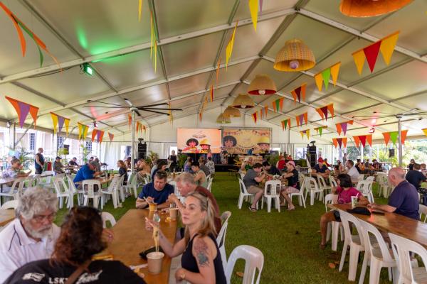 People enjoying laksa under the marquee at the Darwin International Laksa Festival 2021